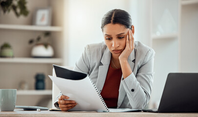 Bored, thinking professional businesswoman reading and managing company financial crisis strategy...