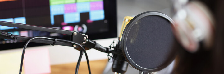 Professional gamer in headphones broadcasting online video games computer monitor