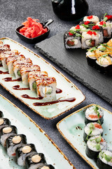 different rolls on beautiful plates with napkins top view composition