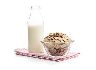 Whole grain cereal flakes and milk. Wholegrain breakfast cereals isolated on white background.