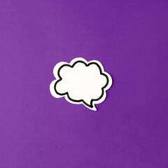 Halloween paper decorations chat bubble mock up on purple background. Flat lay, top view, minimal style, copy space, banner for your site, party invitation, flyer, traditional color