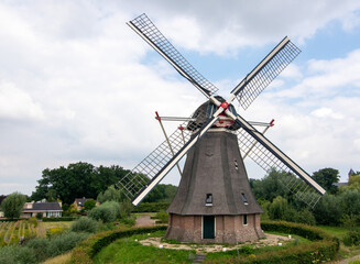 Fototapeta na wymiar 18th century hexagonal windmill in Waardenburg, a village in the Betuwe in the province of Gelderland