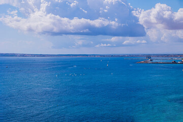  blue seaside landscape with the port of the Spanish city of Alicante on a sunny day
