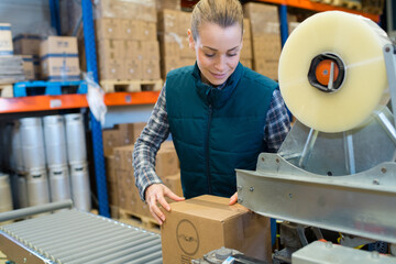young woman in boxing section at a wine factory