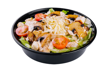 Warm salad with roasted chicken meat, vegetables and mushrooms
