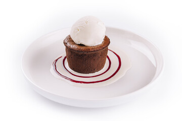 Chocolate fondant and a scoop of ice cream in a white plate