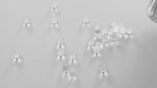 Overuse of vitamins and supplements concept. Black and white. Vitamin D, A, E or omega 3 fish oil concept.