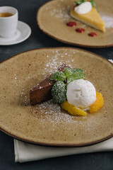 Chocolate brownie with ice cream and vanilla powder