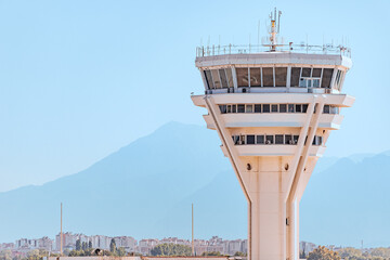 control tower at the airport serving safe takeoffs and landings of aircraft. Runway infrastructure and dispatch work