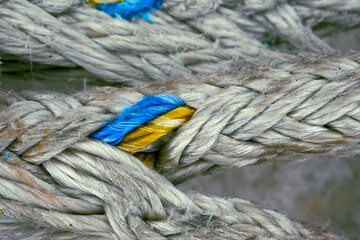 colors of the Ukrainian flag on a rope close-up