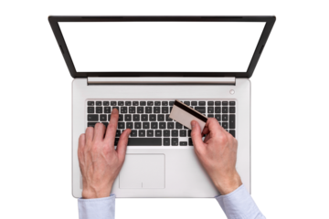 Hands holding credit card and using laptop