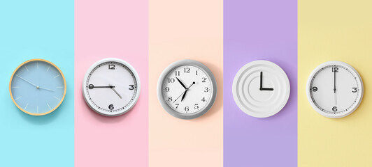 Set of different clocks on colorful background