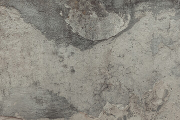 A concrete wall texture with cracks and scratches. Old cement wall, abstract grunge background.
