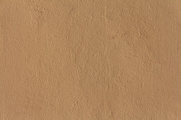 A plaster wall texture. A painted beige concrete wall background.
