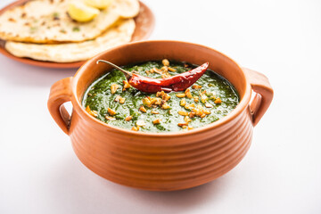 lasooni palak recipe or dhaba style garlic spinach curry, Indian main course served with naan
