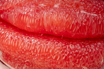 Close up, Red Pomelo or Siam ruby pomelo,Top view of many pieces of peeled Red Pomelo or grape...