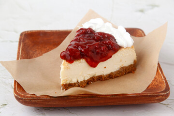 Slice of freshly baked strawberry cheesecake