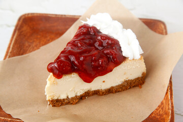 Slice of freshly baked strawberry cheesecake