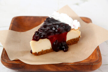 Slice of freshly baked blueberry cheesecake