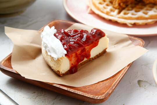 Slice of freshly baked strawberry cheesecake