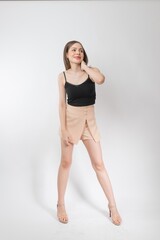 Fototapeta premium Full length body portrait of a young beautiful asian female business executive wearing stylish friday attire and pose with different gestures & emotions. Suitable for business presentation or slides