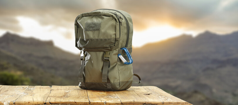 Desk of free space and green backpack. - Powered by Adobe