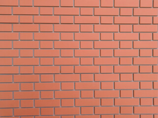 Photo of red brick wall on concrete for background