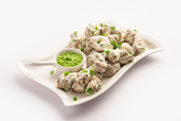 vegetarian soya malai chap made using soya chaap with white creamy gravy