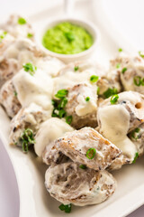 vegetarian soya malai chap made using soya chaap with white creamy gravy