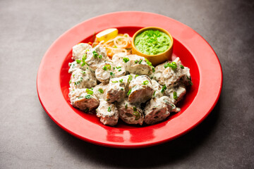 vegetarian soya malai chap made using soya chaap with white creamy gravy