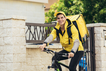 Male courier with bicycle delivering packages