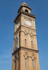 Fototapeta na wymiar 100 year old Indo-Saracenic Clock Tower (known as Dodda Gadiaya or Silver Jubilee Clock Tower) with numerals in Kannada language at Mysore, Karnataka, India