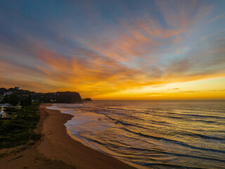 Sunrise and high cloud cover over the sea