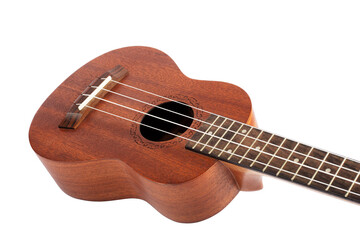 Wooden ukulele guitar isolated over white background.