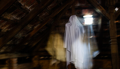 Obraz na płótnie Canvas blurred image of ghost in the attic haunted house for Halloween