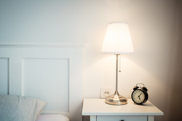 vintage alarm clock in bright bedroom