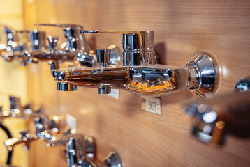 Faucets in a shop with household equipment