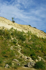 Beautiful summer day with green grass, meadow and blue sky panorama.  Sandberg hill in summer, Slovakia. Protected prehistoric area with sandstone.