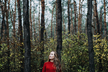 Fototapeta na wymiar Mindfulness-based cognitive therapy, Mindfulness practices. Young woman with long hair relaxing in forest