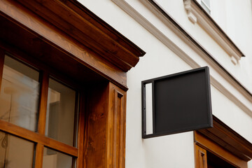 Blank signboard mock up, on the facade. Copy space for your store sign or logo. Modern empty...