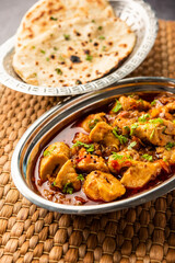 Punjabi soya chaap gravy or dhaba style soya chap masala sabzi served with naan