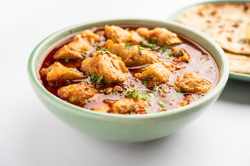 Punjabi soya chaap gravy or dhaba style soya chap masala sabzi served with naan