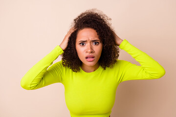 Closeup photo of young stressed woman touch chevelure hands panic forget car key isolated on beige color background