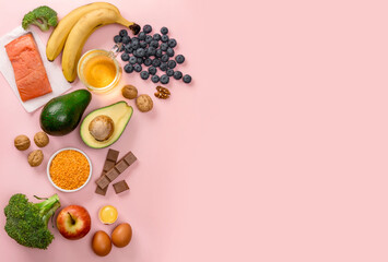 Best foods for brain and memory on pink background. Food for mind and charge of energy. Healthy lifestyle. Copy space. Top view. Mind diet