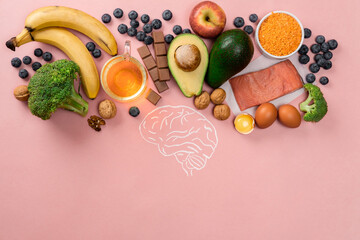 Best foods for brain and memory on pink background. Food for mind and charge of energy. Healthy...