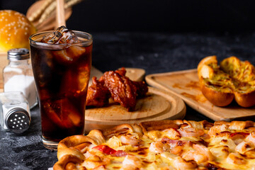 Pizza served with cold drink