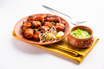 Tandoori Soya Chaap or soy chap dish prepared by marinating in tandoori spices, closeup view