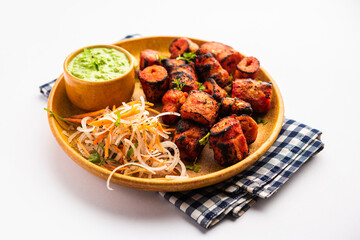 Tandoori Soya Chaap or soy chap dish prepared by marinating in tandoori spices, closeup view