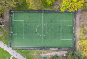High angle drone view of football field in Agrykola Park in Warsaw city, Poland