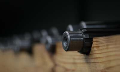 Industrial metal gear at factory. Prefabricated bearings of small diameter metal products and...